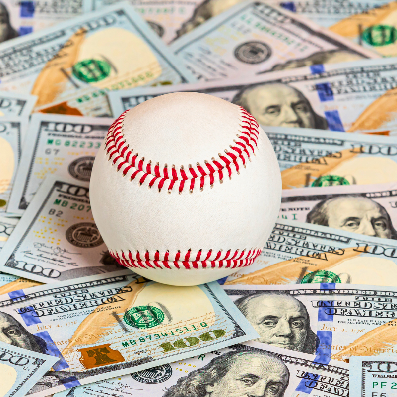 Baseball with cash money. Sports Fraud Theft.