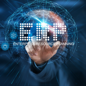 Businessman points at virtual ERP network connecting service with graphical icons in manufacturing, supply chain, and logistics industry.