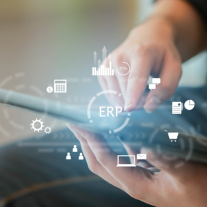 A close up employee man hand holding a tablet and using an ERP program application to connect with team or check system for future business and data development concept.